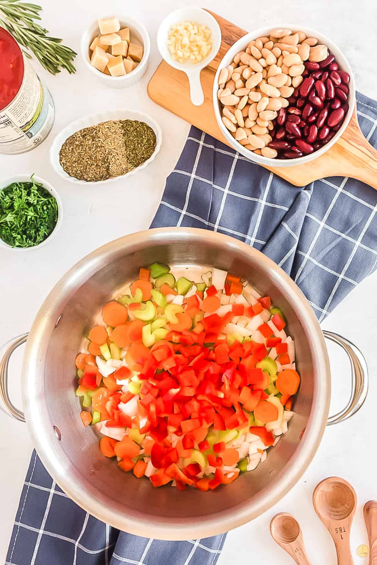 soup pot with veggies on a blue napkin