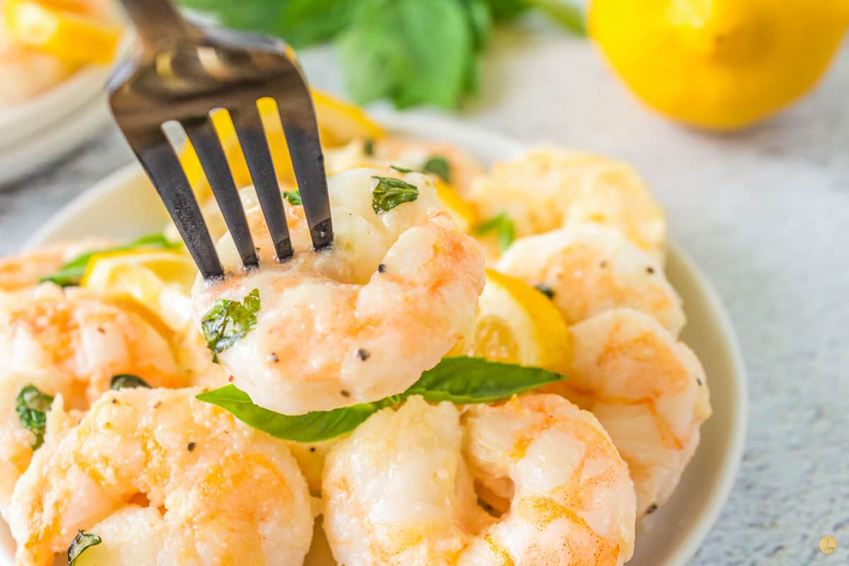 fork of shrimp and lemons