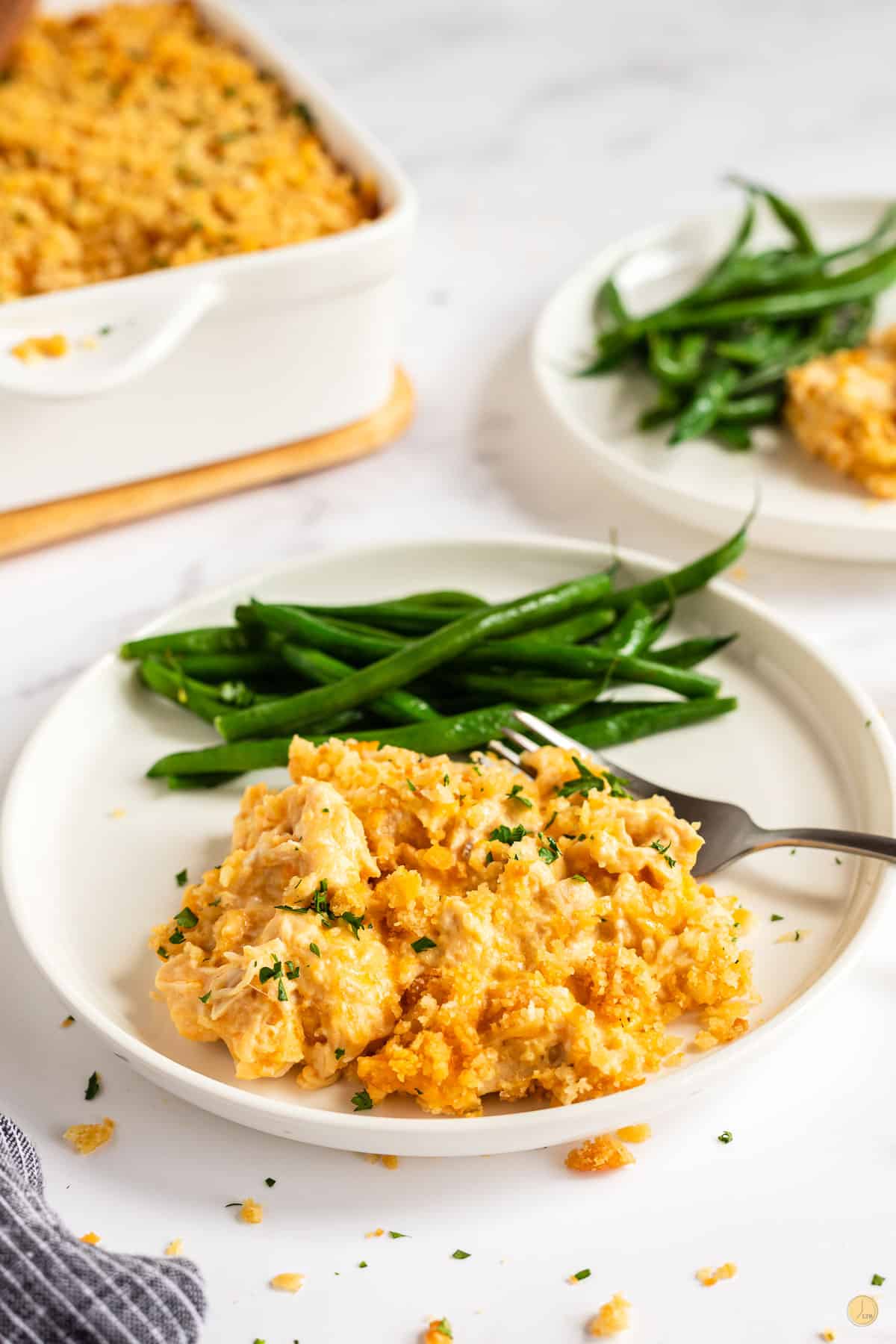 plate of million dollar chicken casserole and green beans