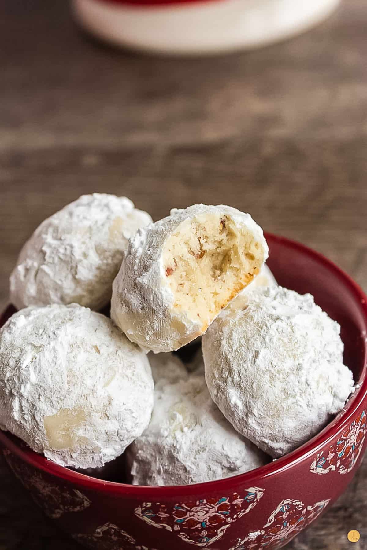 red bowl of pecan snowball cookies