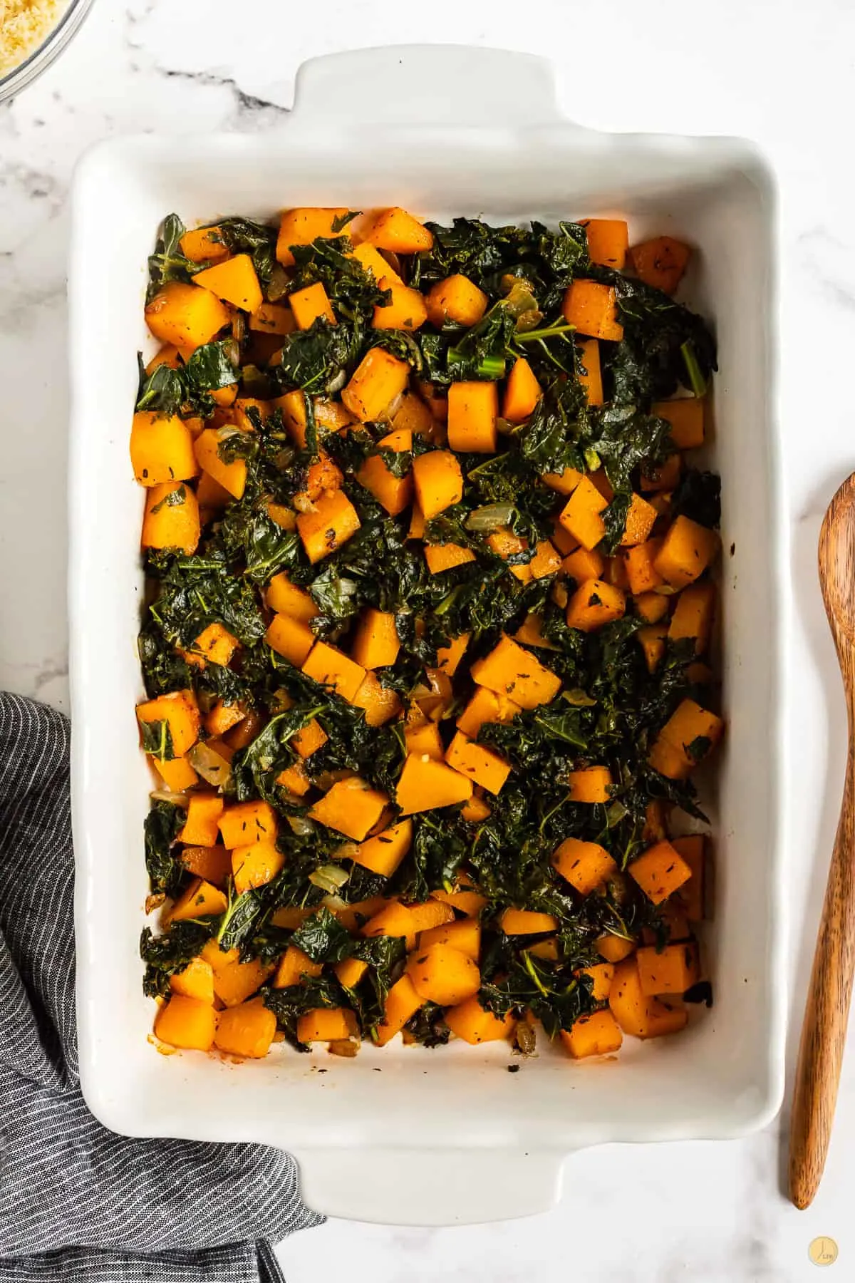 baked squash and kale in a dish