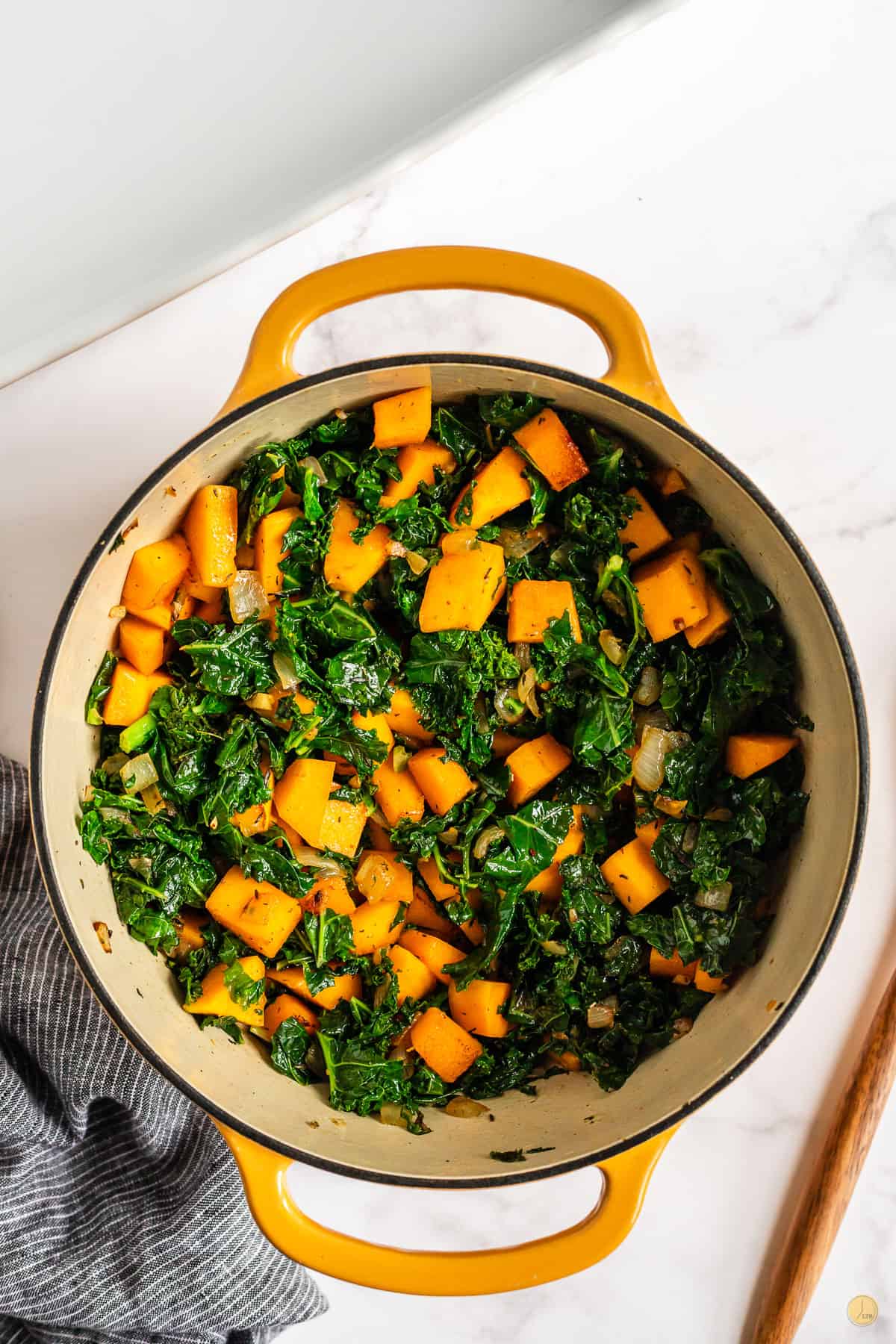 squash and kale in a pot