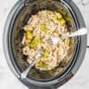 chicken in a crockpot with two forks