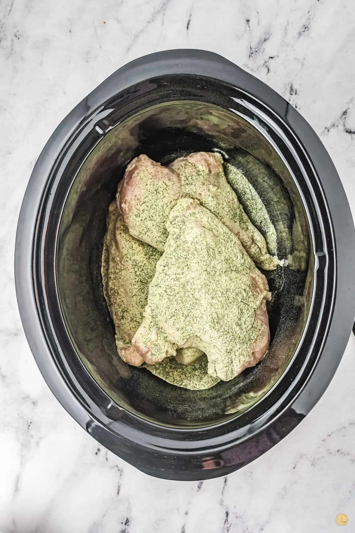 chicken and ranch seasoning in a crock pot