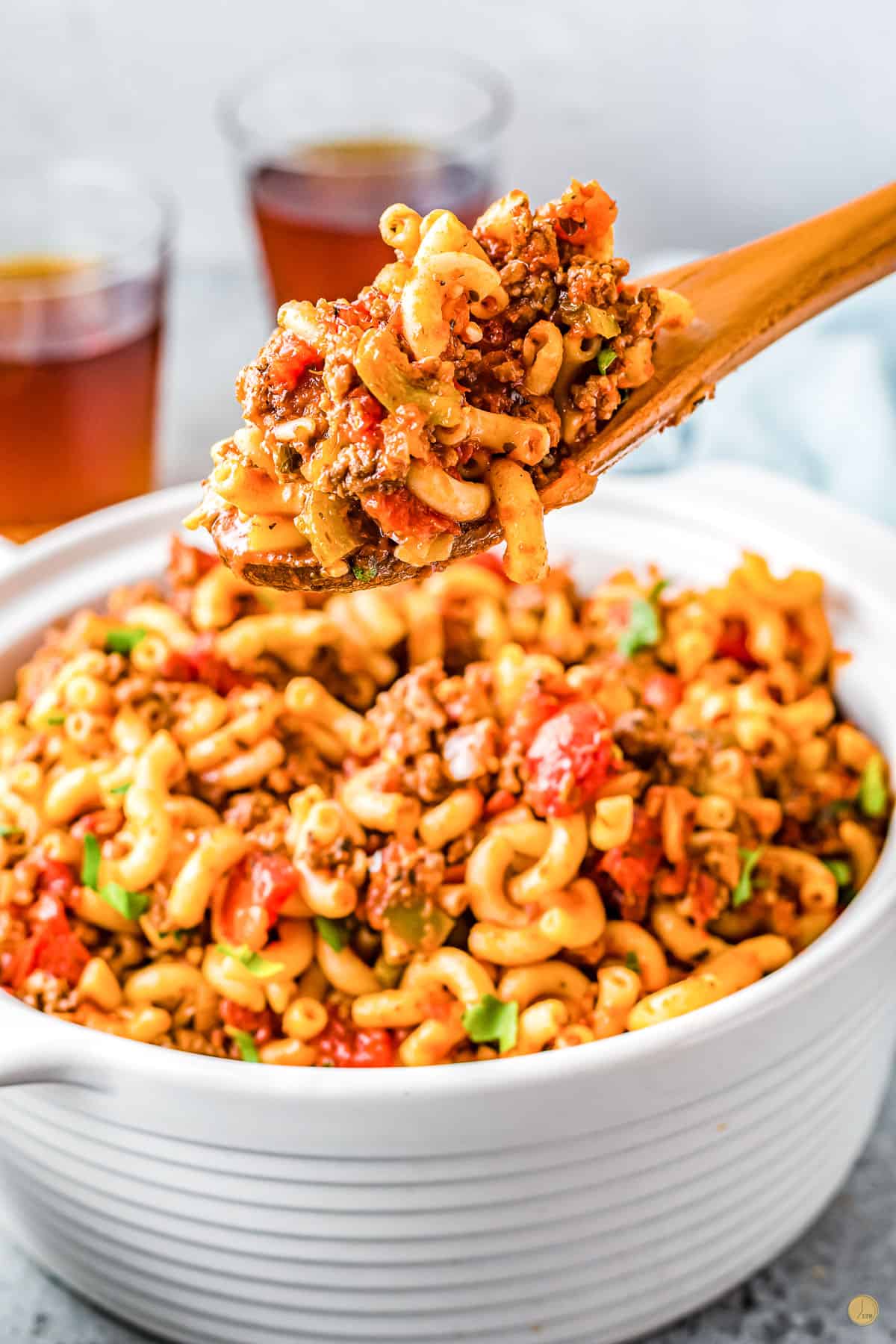 wood spoon with heap of goulash