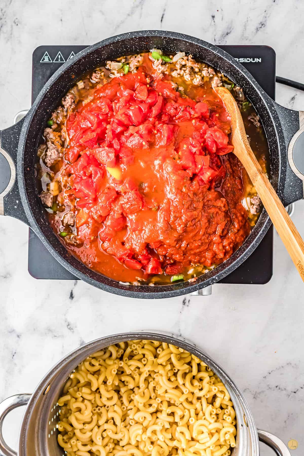 tomatoes and macaroni in a pan