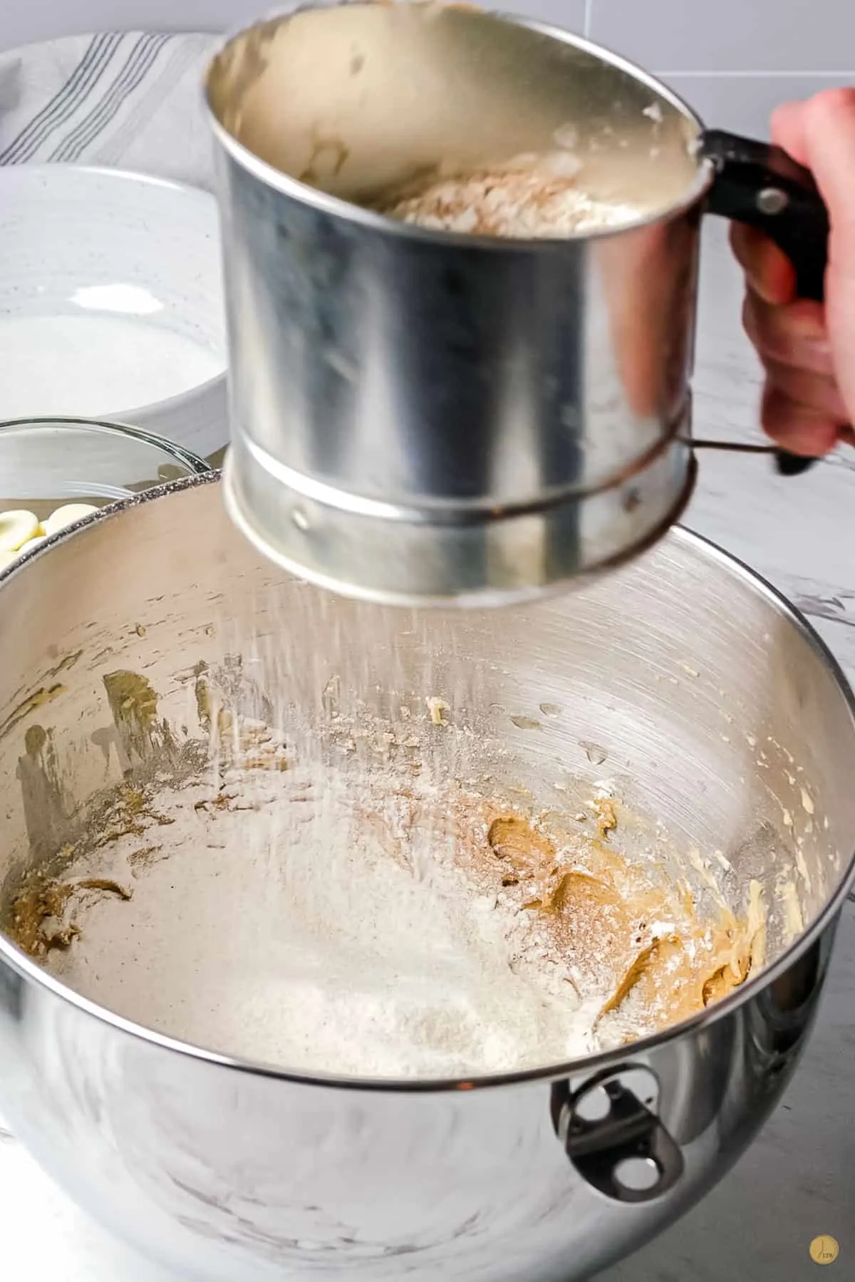 flour sifting in a bowl