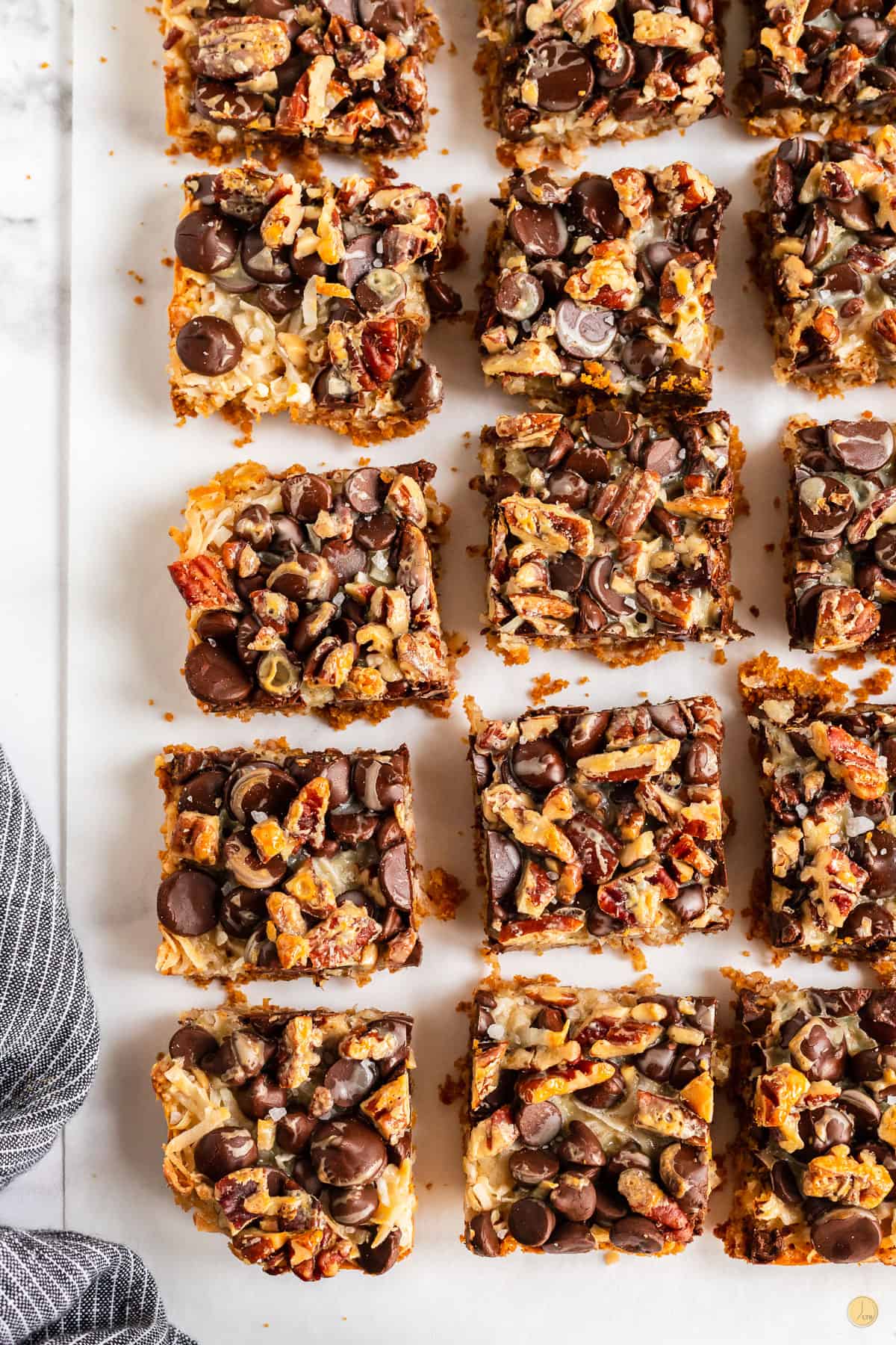 magic cookie bars on parchment paper