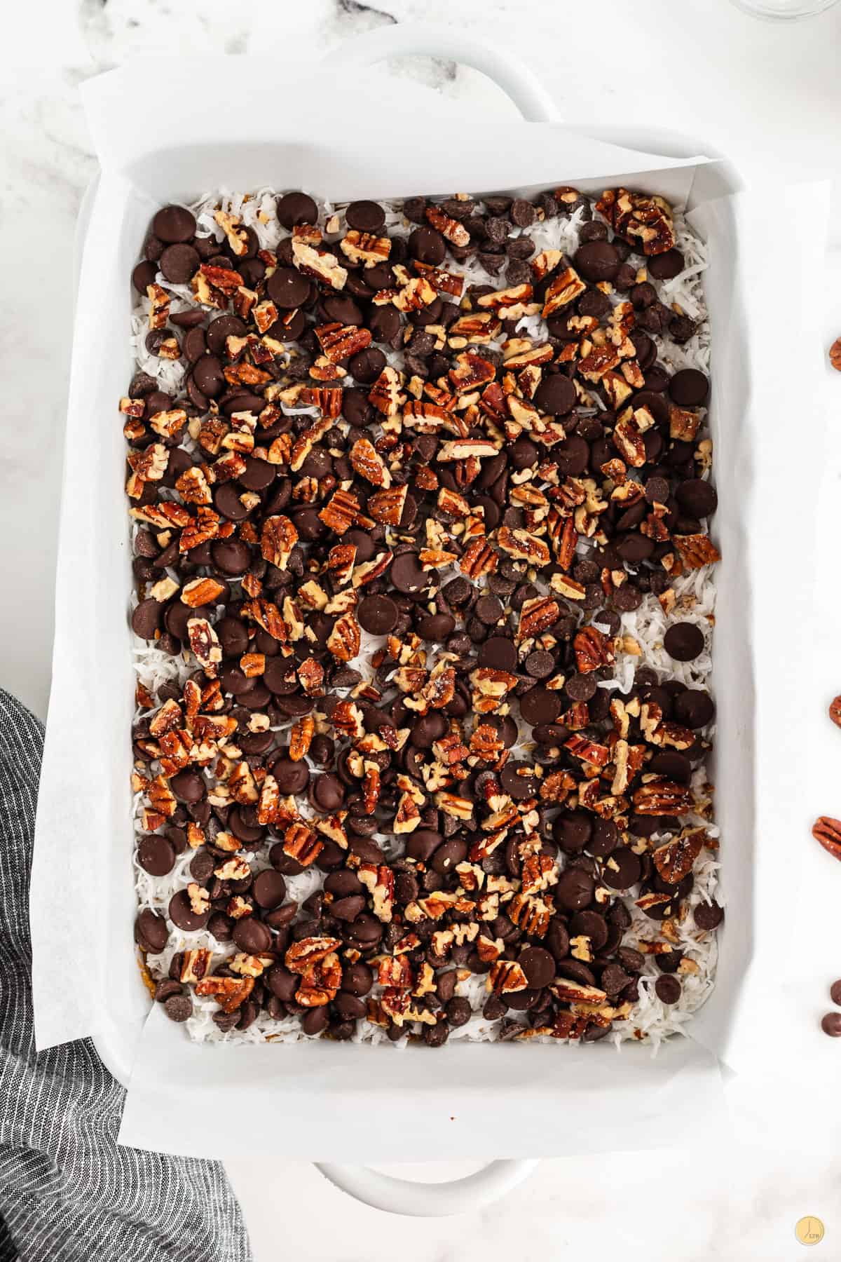 chocolate chip and pecans in a baking dish