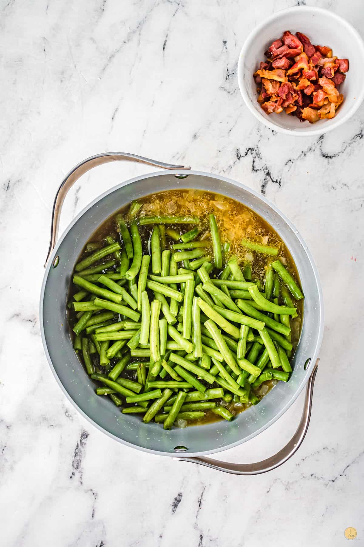 souther green beans simmering over medium-high heat