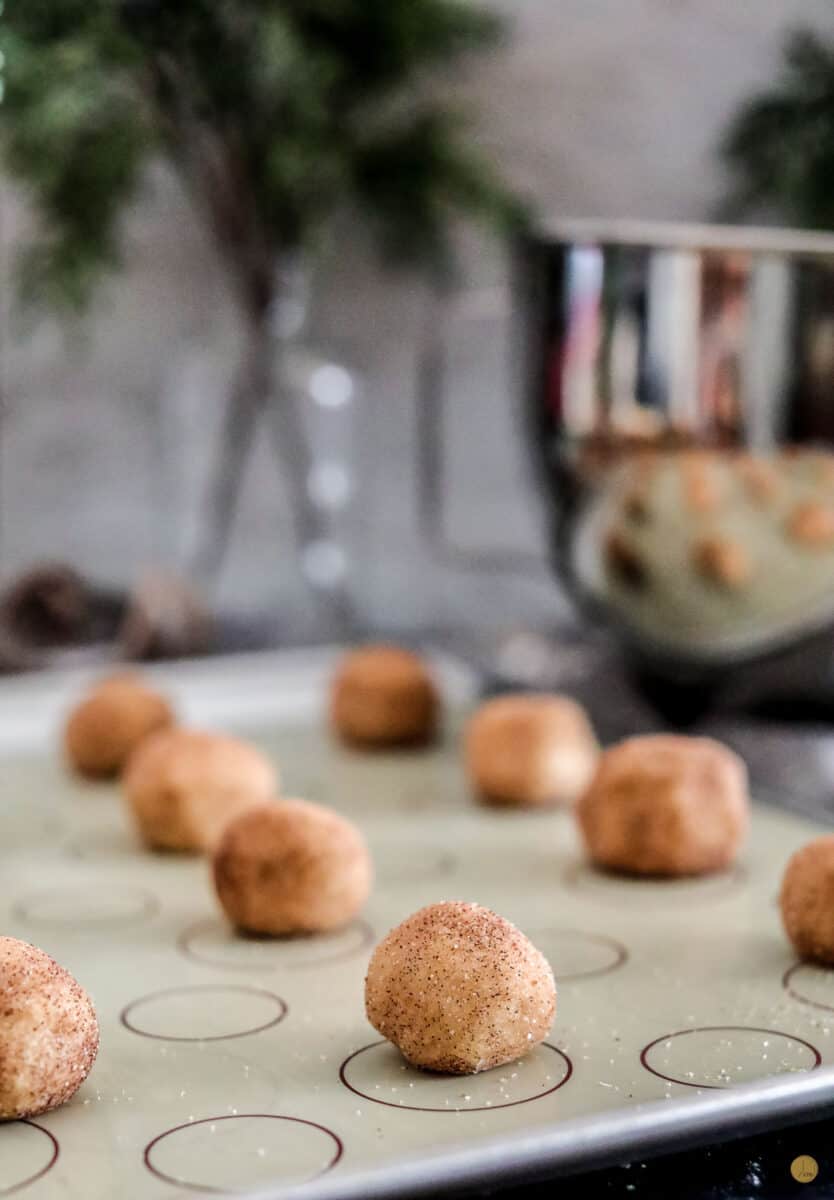 snickerdoodle dough balls on baking sheet