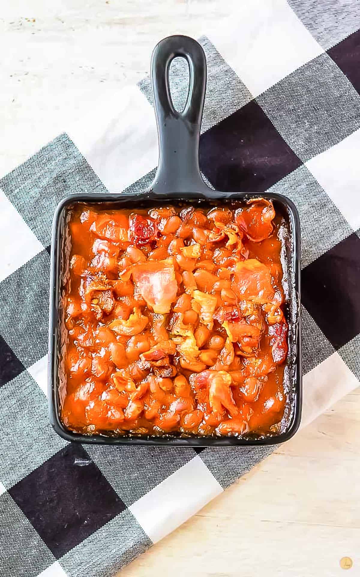 square cast iron pan with baked beans