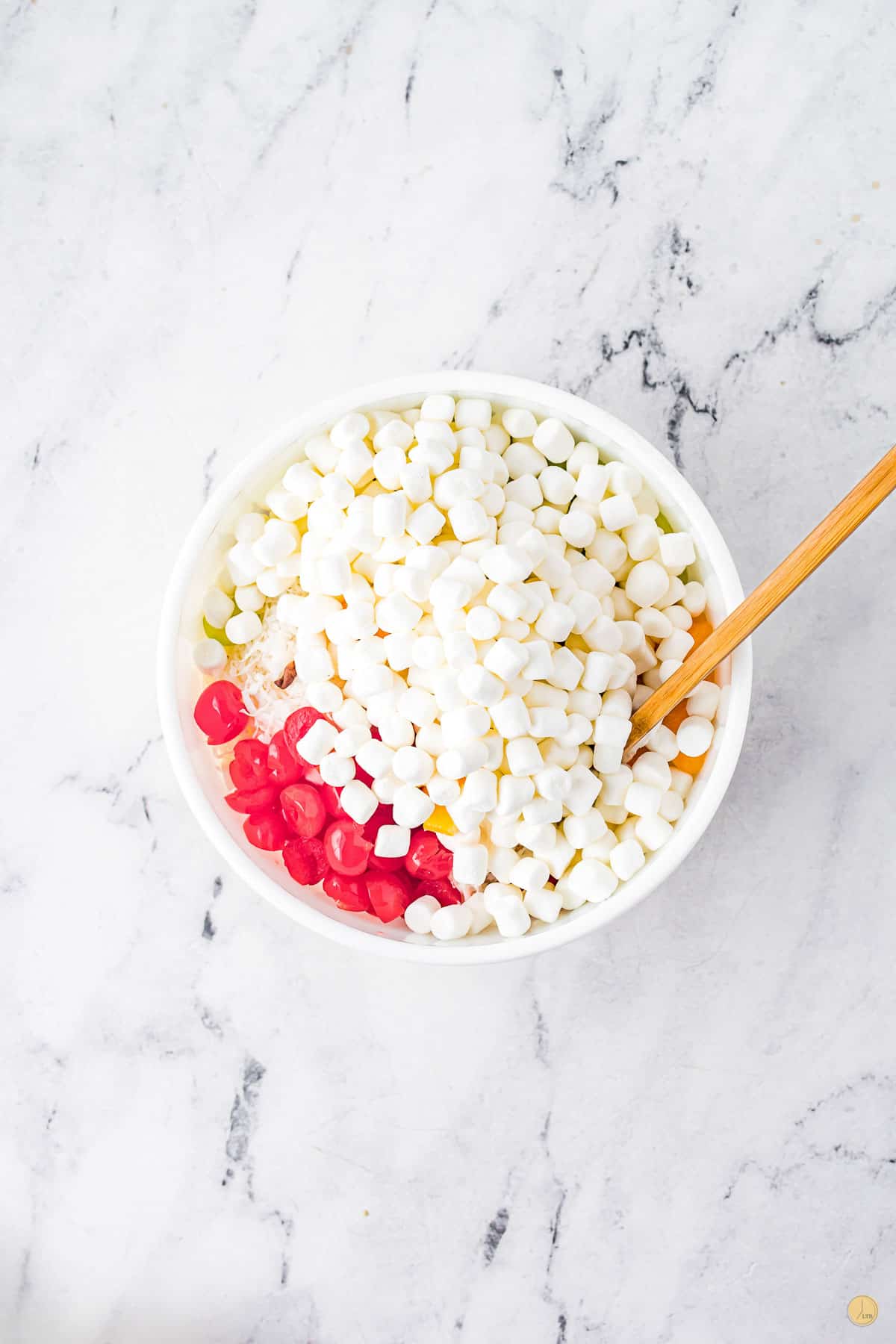 mini marshmallows and cherries in a bowl