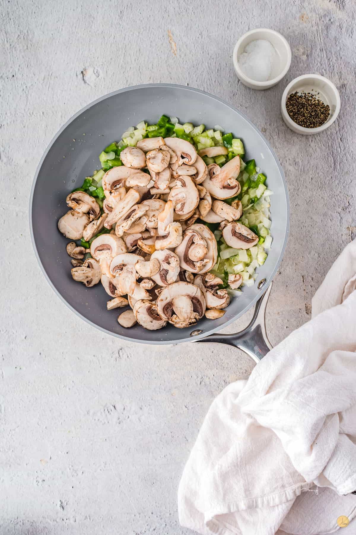 veggies and mushrooms in pan