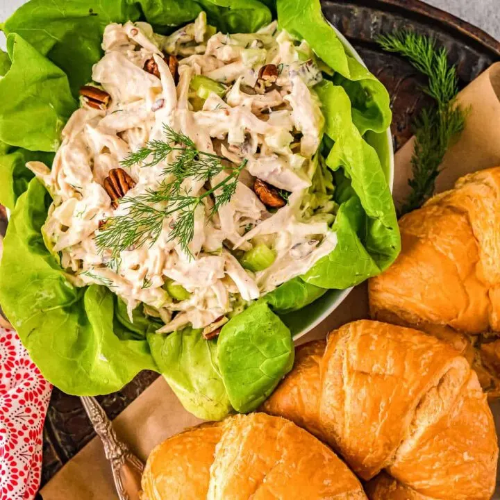 overhead bowl of chicken salad and croissants
