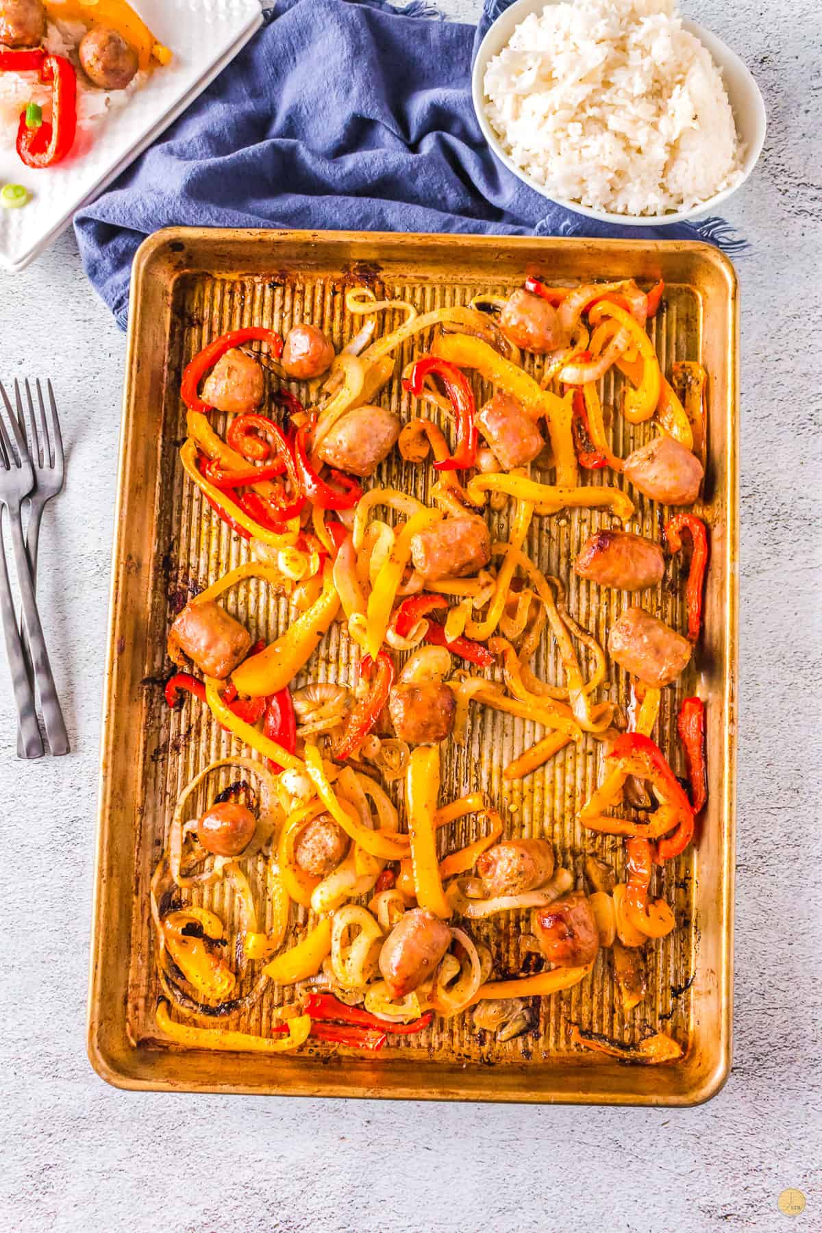 baking sheet with sausage and peppers