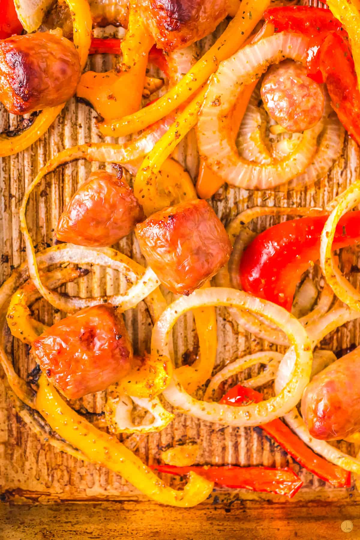 close up of baked sausage with peppers