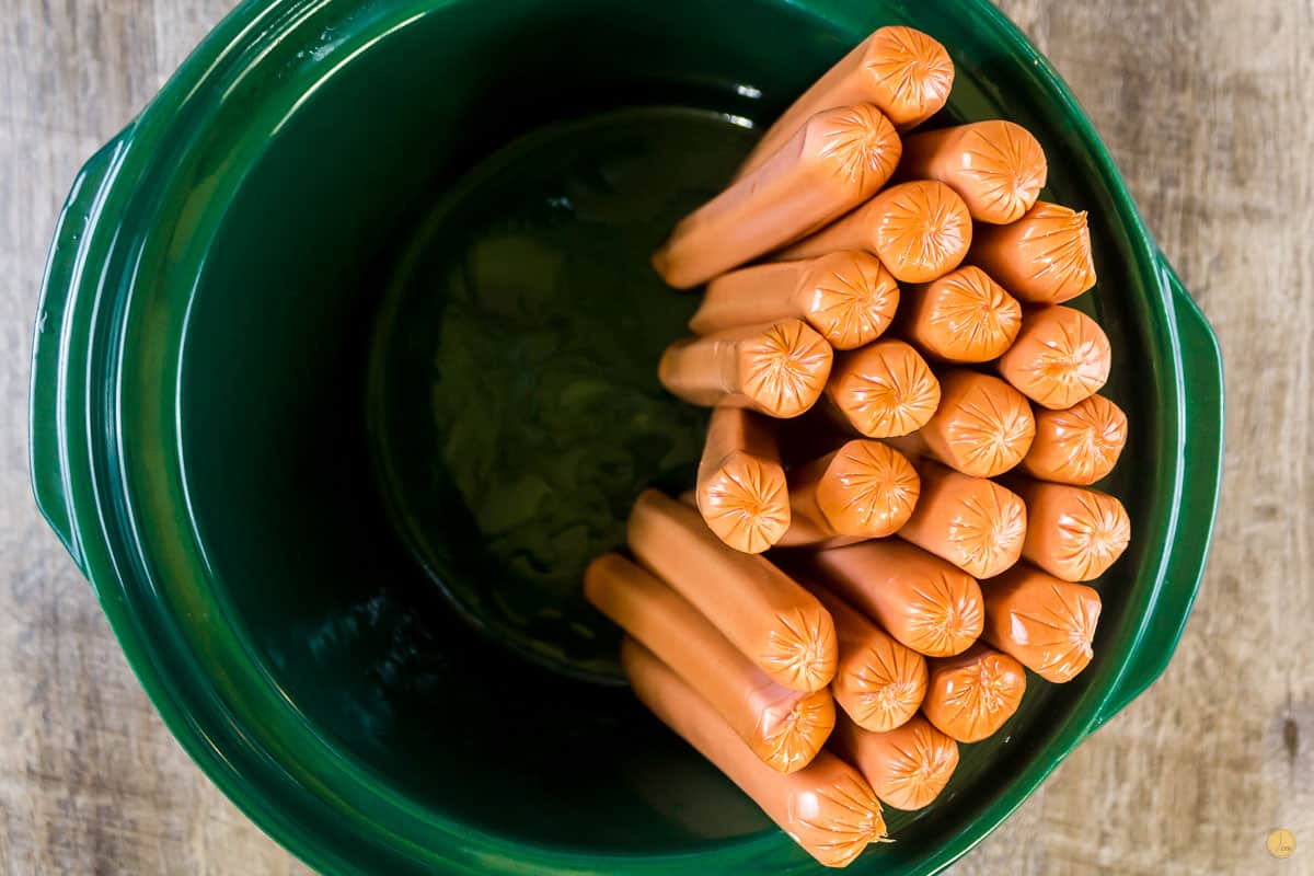 hot dogs standing up in slow cooker