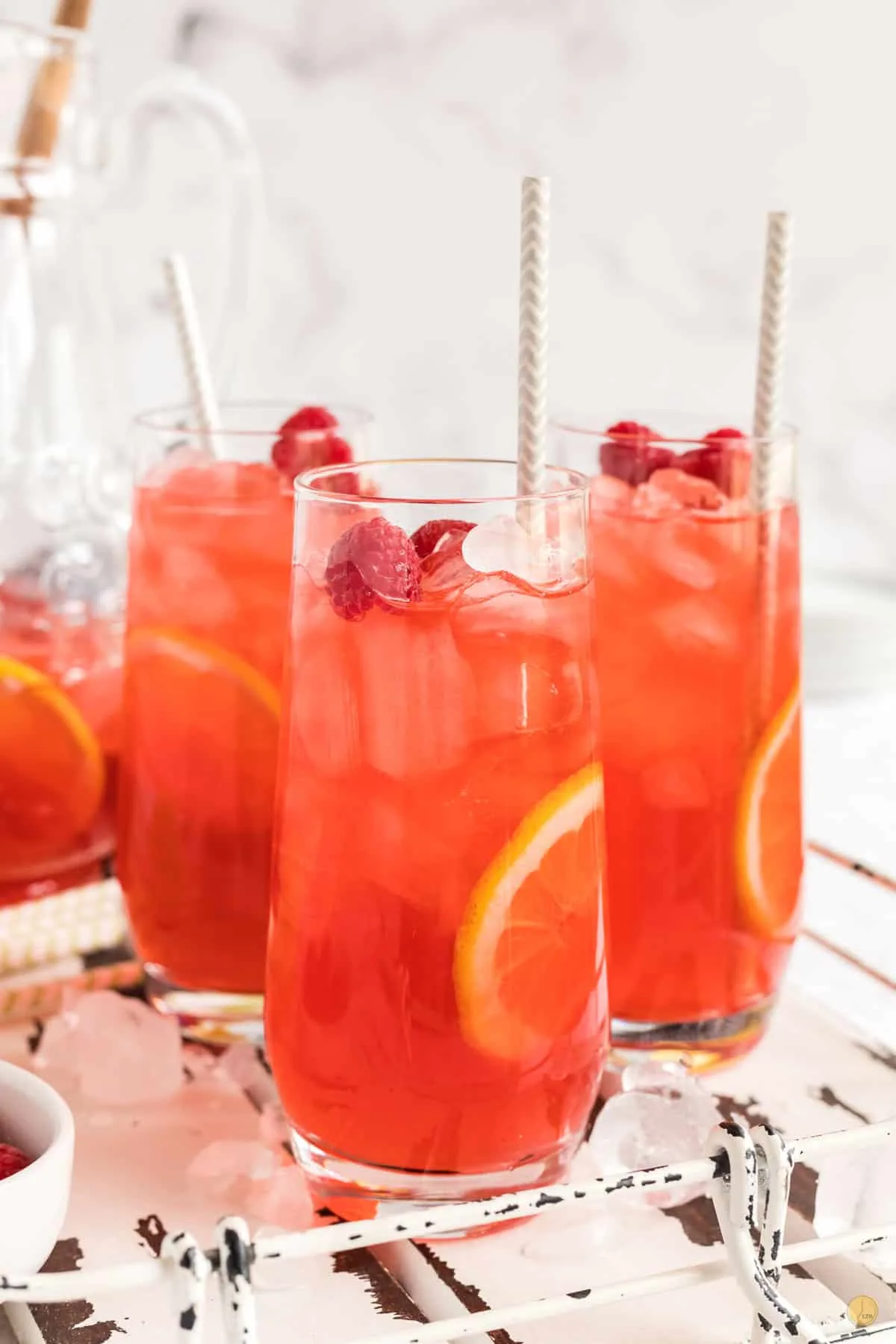 three glasses of raspberry iced tea