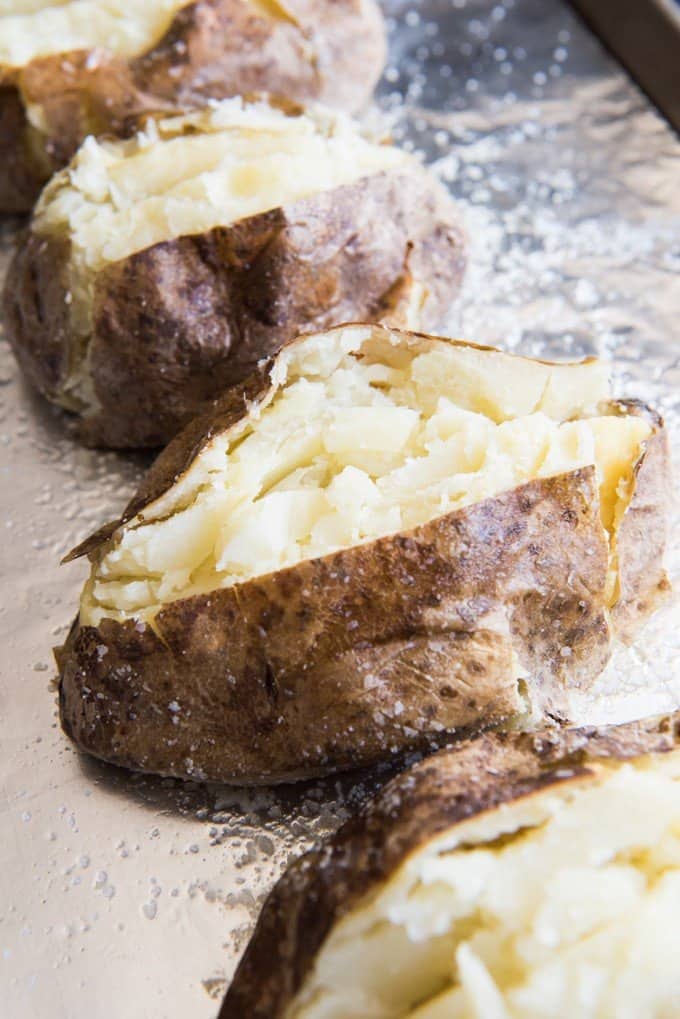 baked potatoes on foil are a great side dish for meatballs