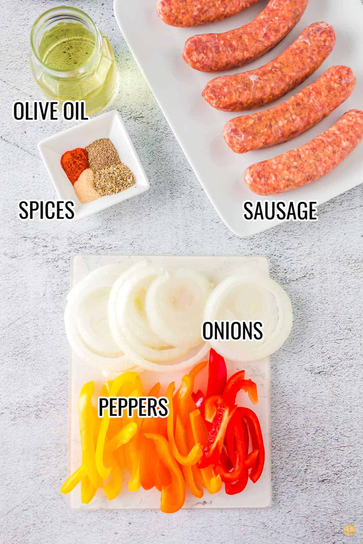 simple ingredients for sausage, peppers, and onions sheet pan meal