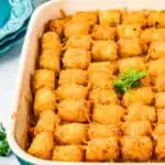 Tater tot Casserole in a blue and white rectangle dish.