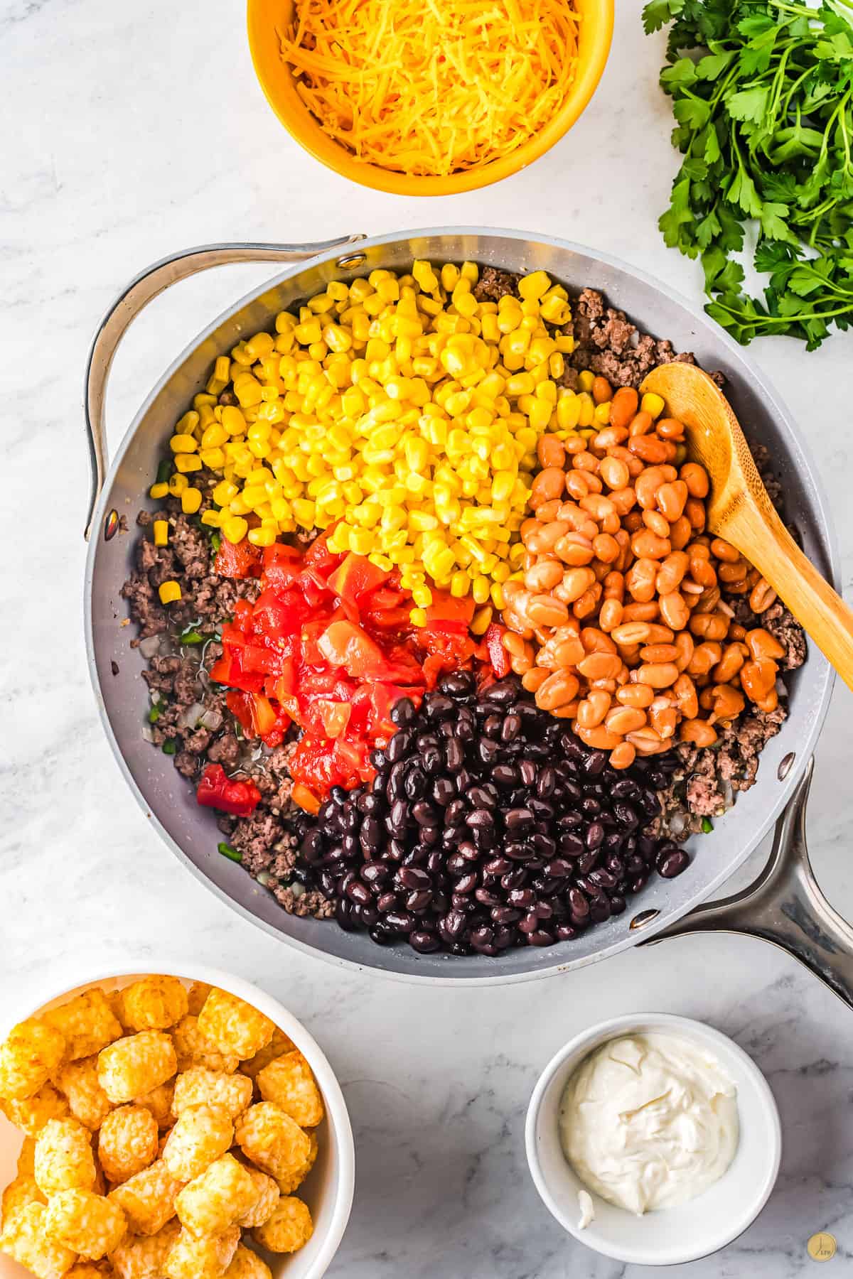 skillet with beans, corn , and tomatoes