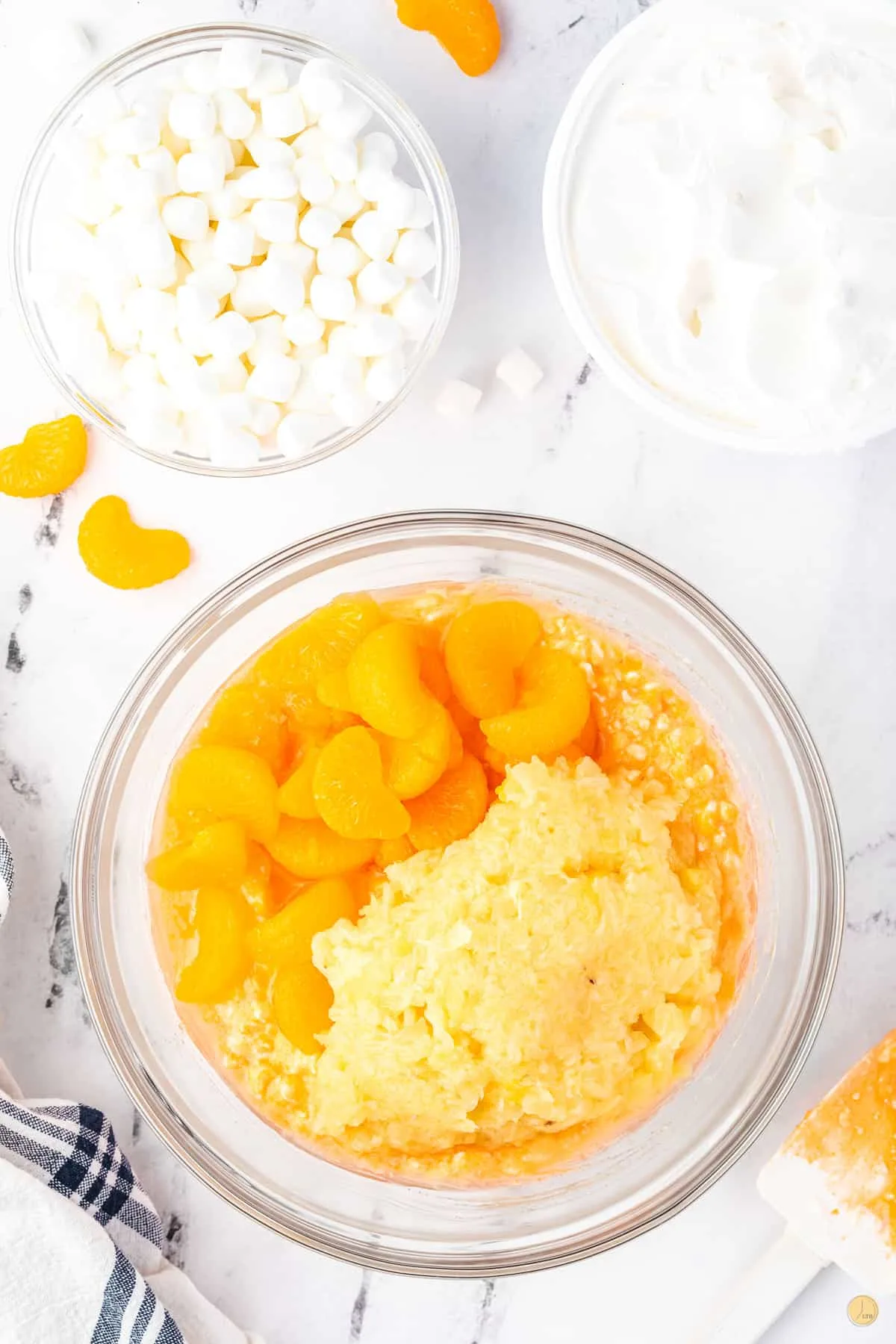 oranges and pineapple in a bowl