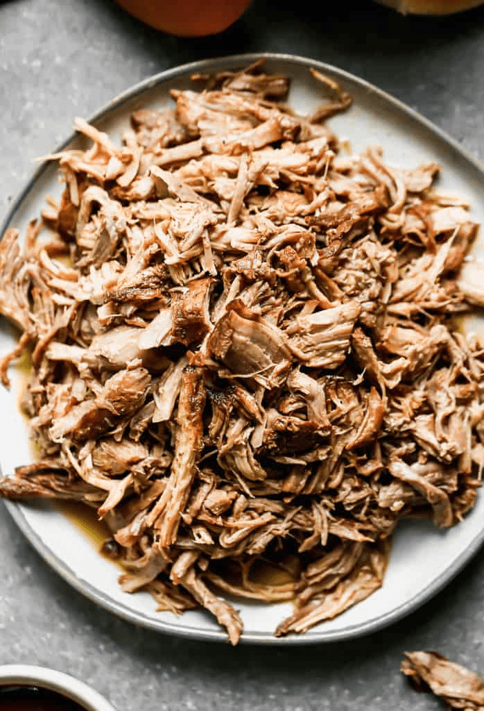 Pulled pork on a white plate. 