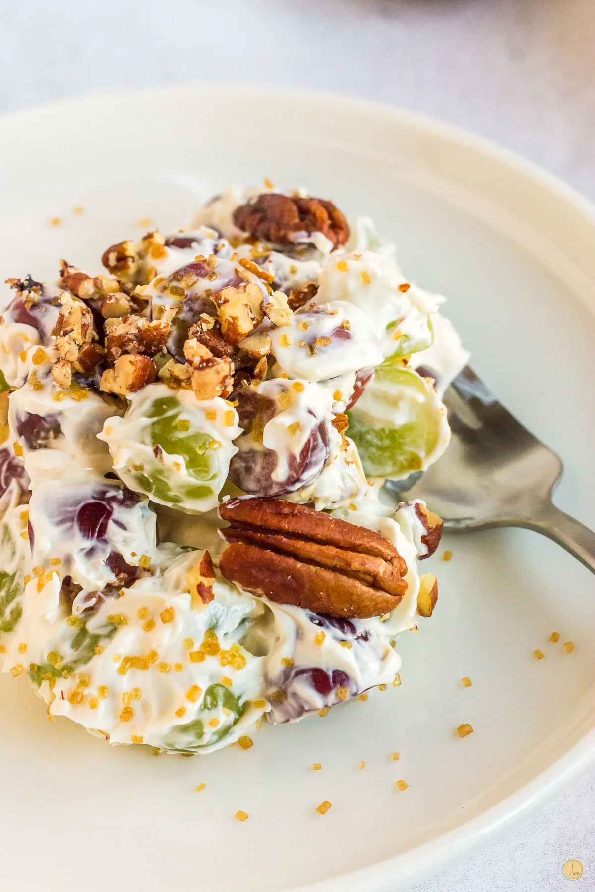 plate of grape salad with fork