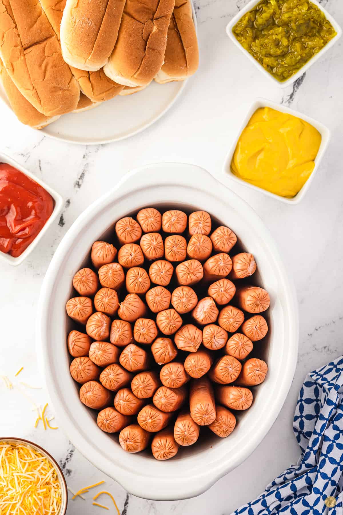 slow cooker full of hot dogs