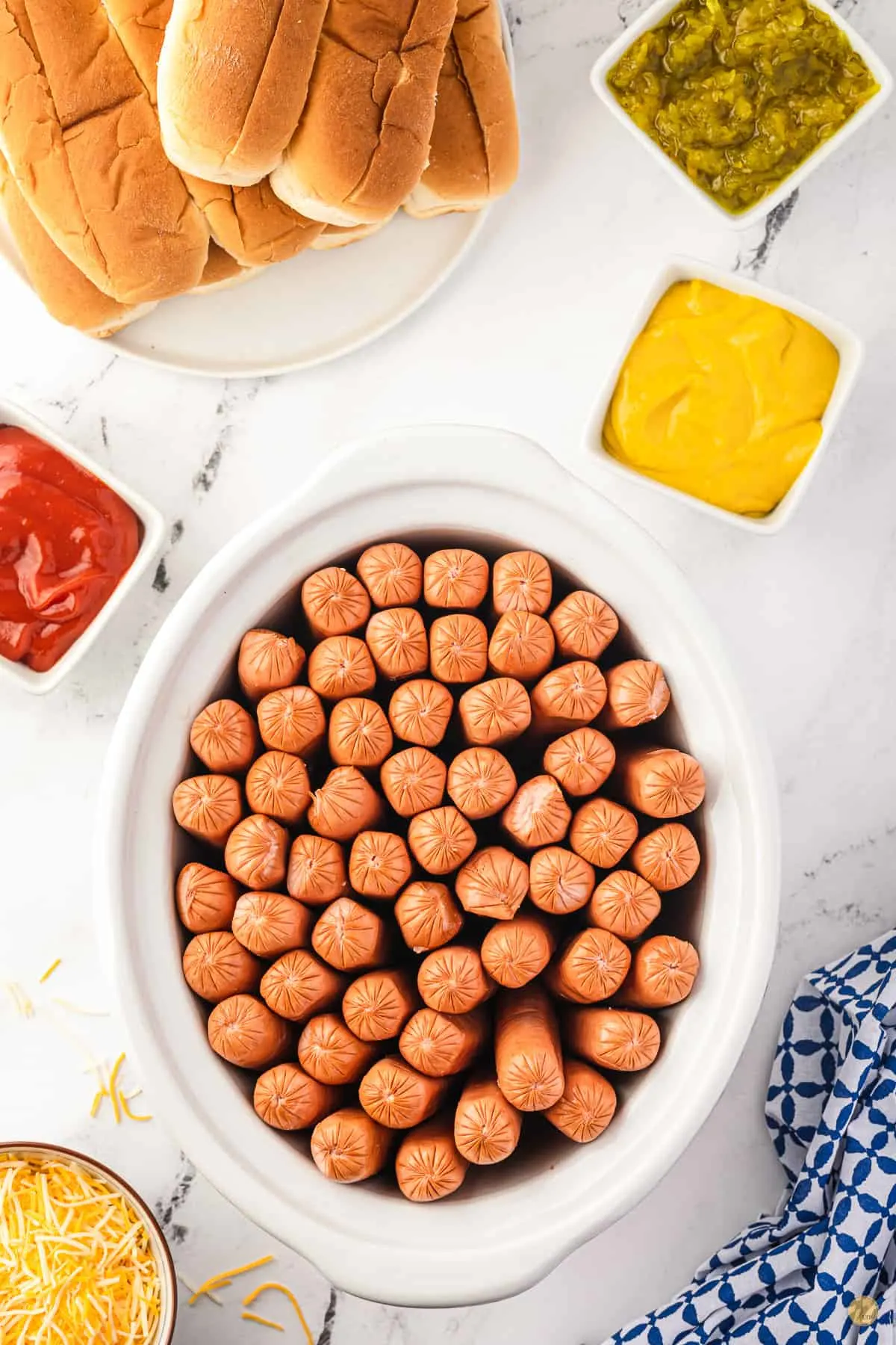slow cooker full of hot dogs