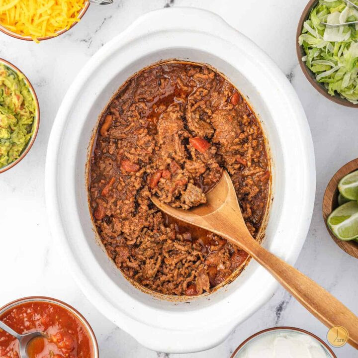 taco seasoned ground beef in a white crockpot