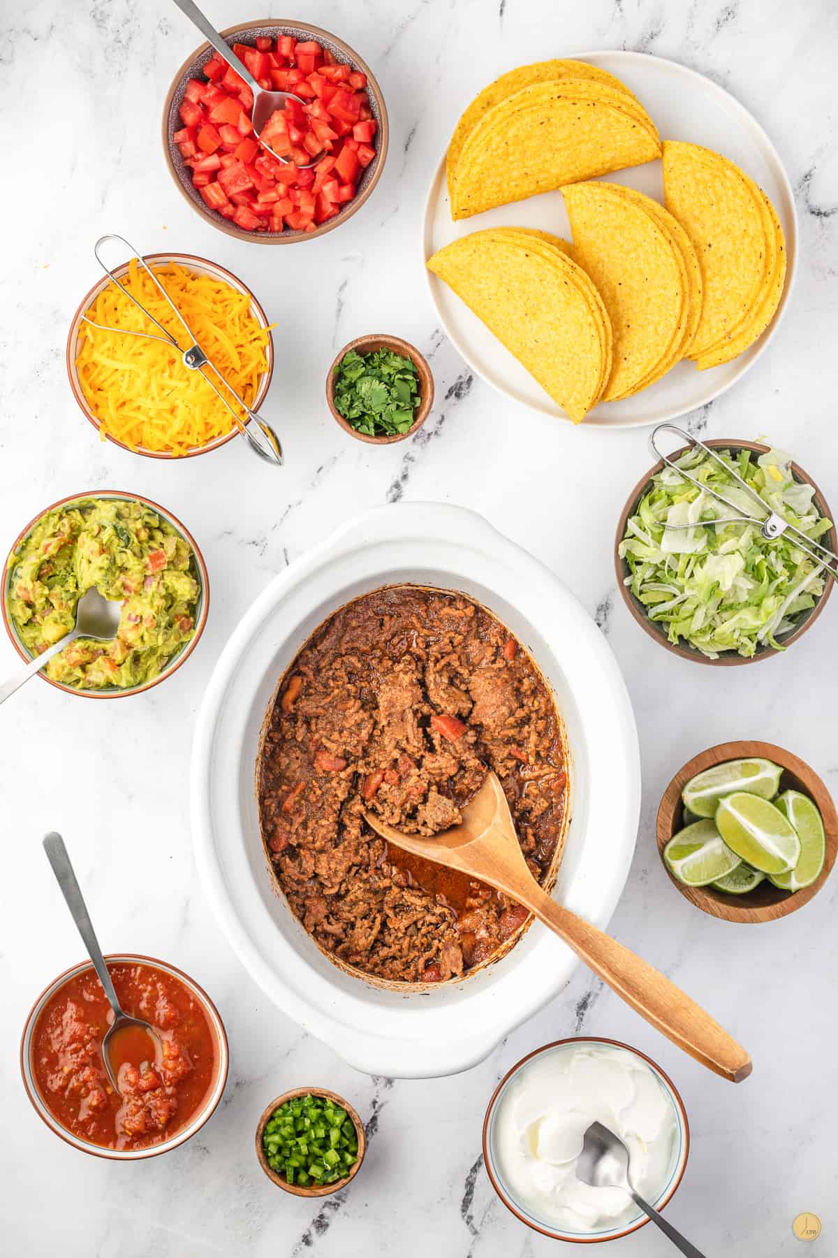 ingredients for slow cooker taco bar in bowls