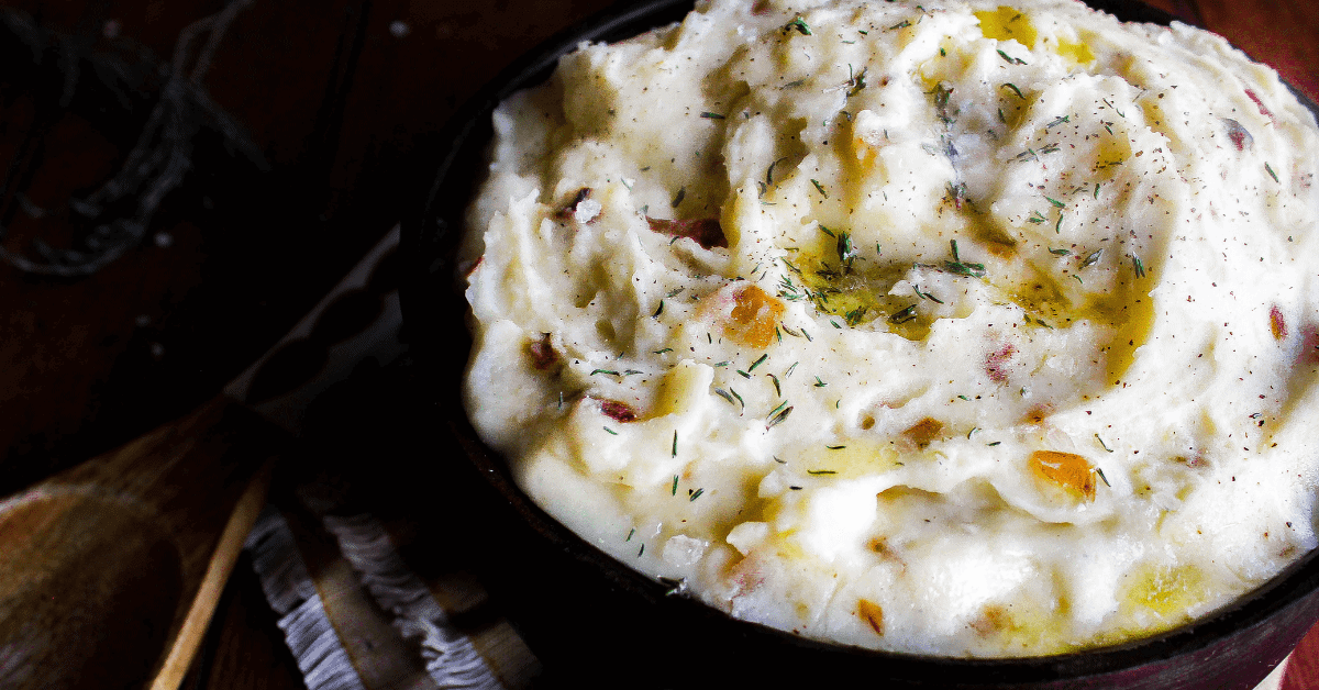 gouda mashed potatoes in a serving dish