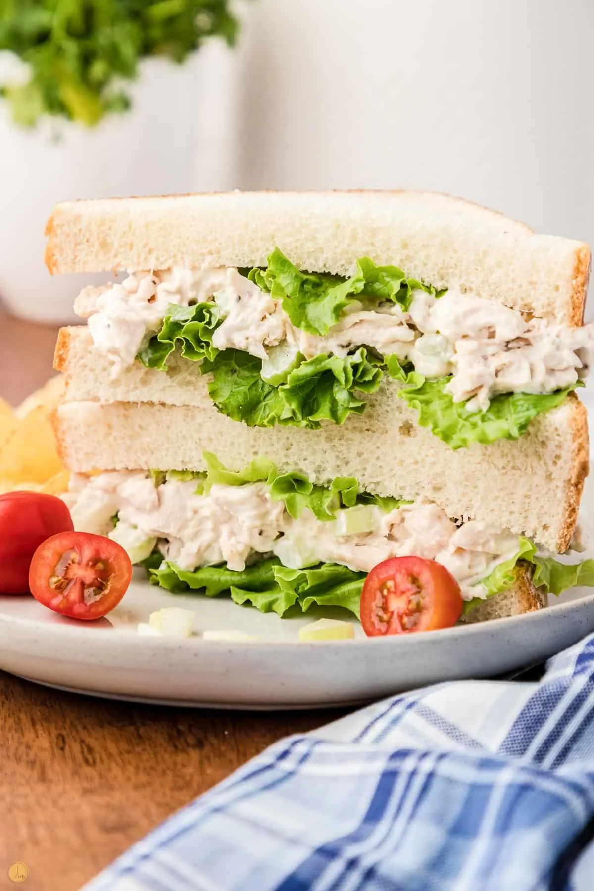 stack of cut chicken salad sandwiches