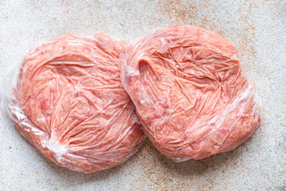 two packages of ground turkey wrapped in plastic wrap
