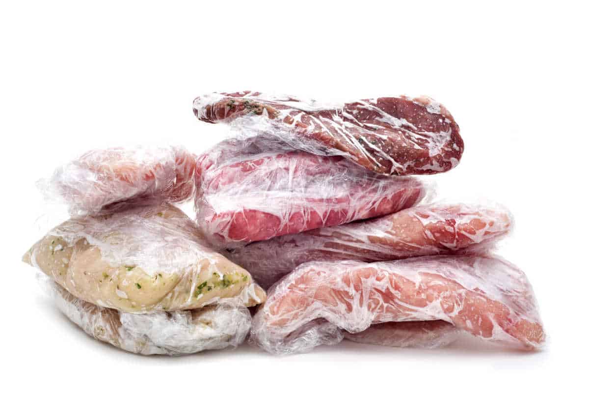 various packages of frozen meats wrapped in plastic