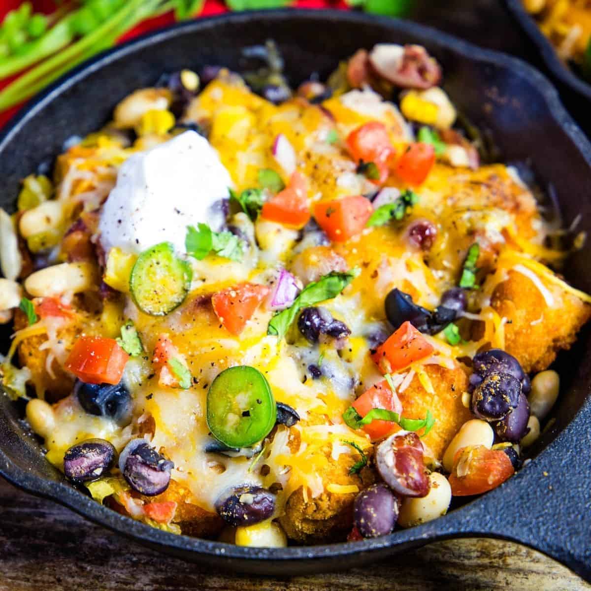 totchos in a cast iron skillet