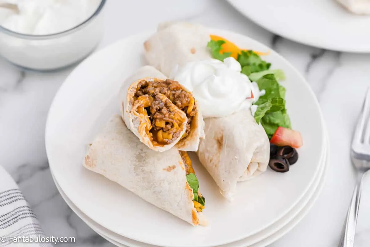 burritos on white plates