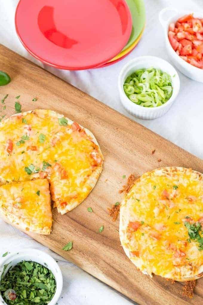 mexican pizzas on a board