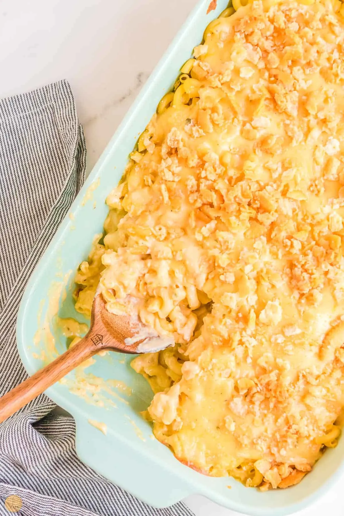 dish of baked mac and cheese with a spoon in it