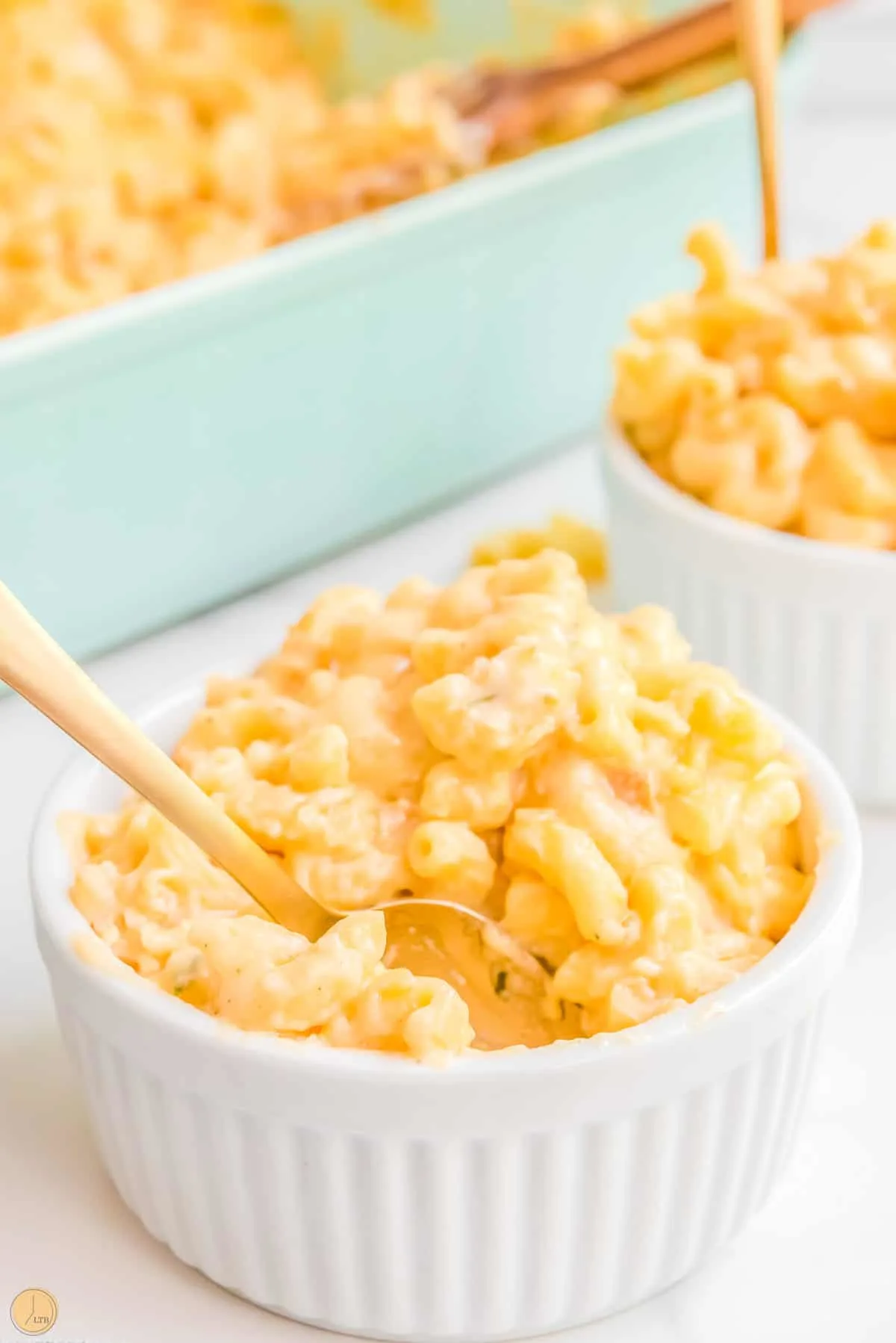 small bowls of mac and cheese with gold forks
