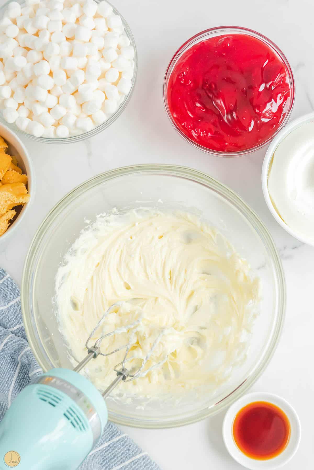 cream cheese mixed in a clear bowl