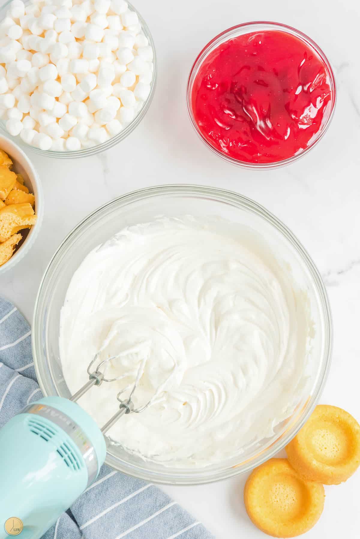 whipped topping mixed in a clear bowl