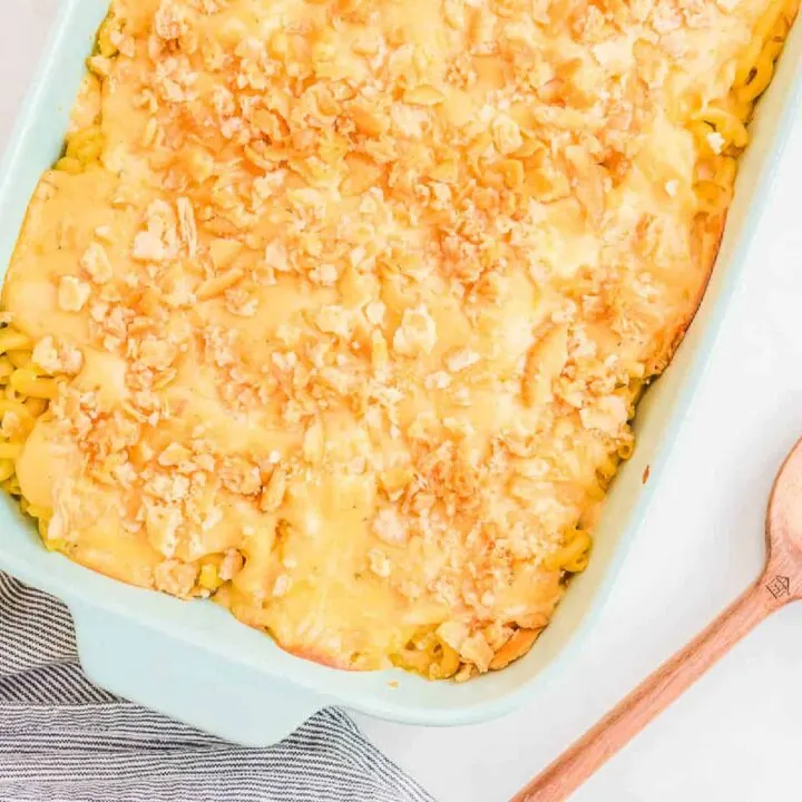 overhead picture of mac and cheese with a wood spoon