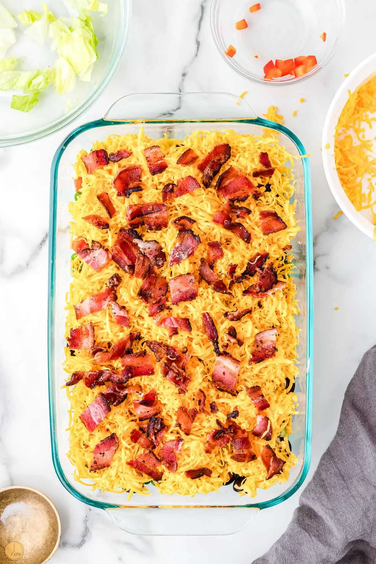 cheese and bacon in a casserole dish