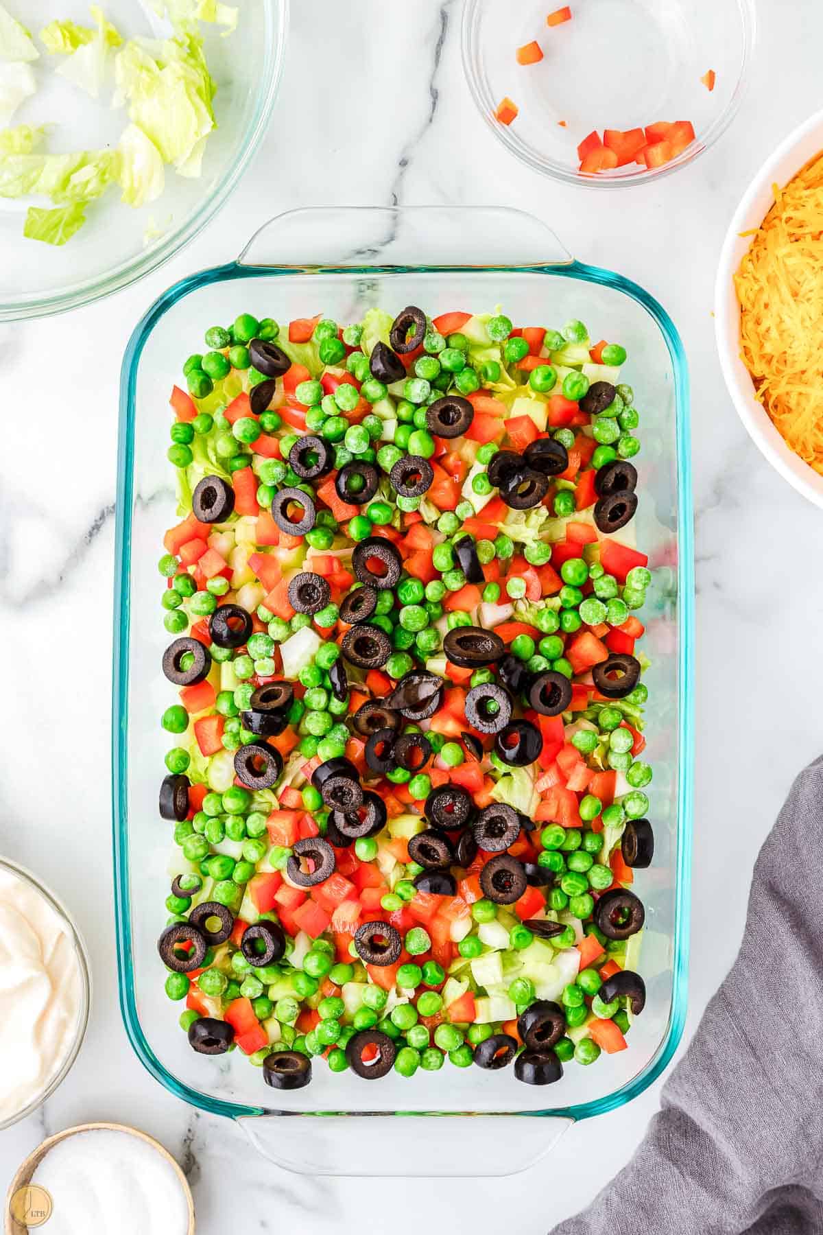 casserole dish with salad ingredients in it