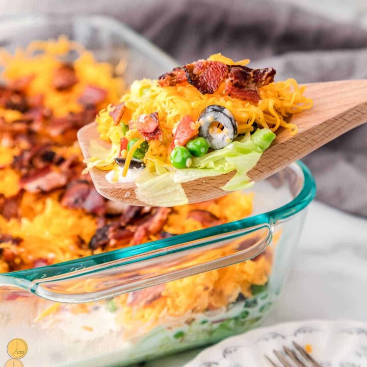 wood spoon with a scoop of salad