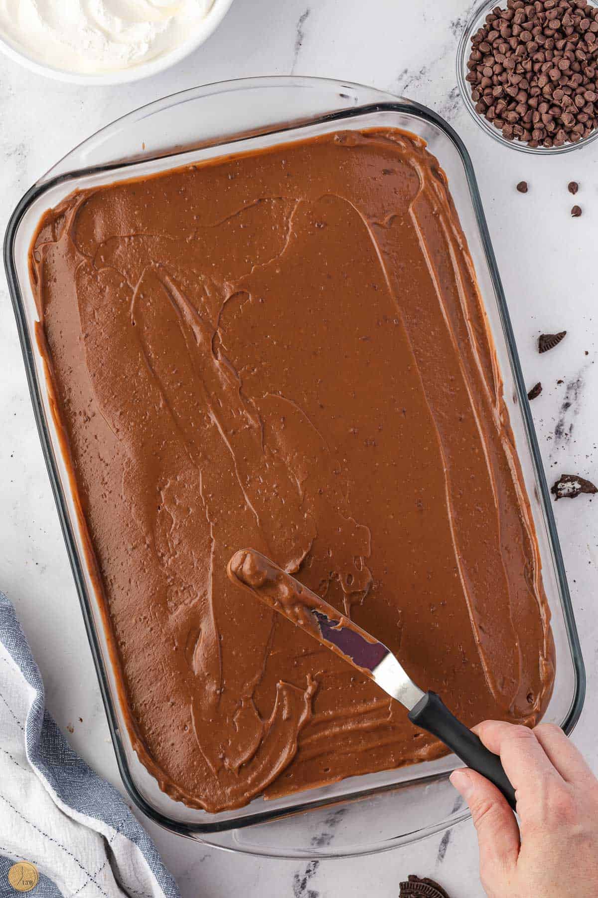 offset spatula on a layer of chocolate pudding